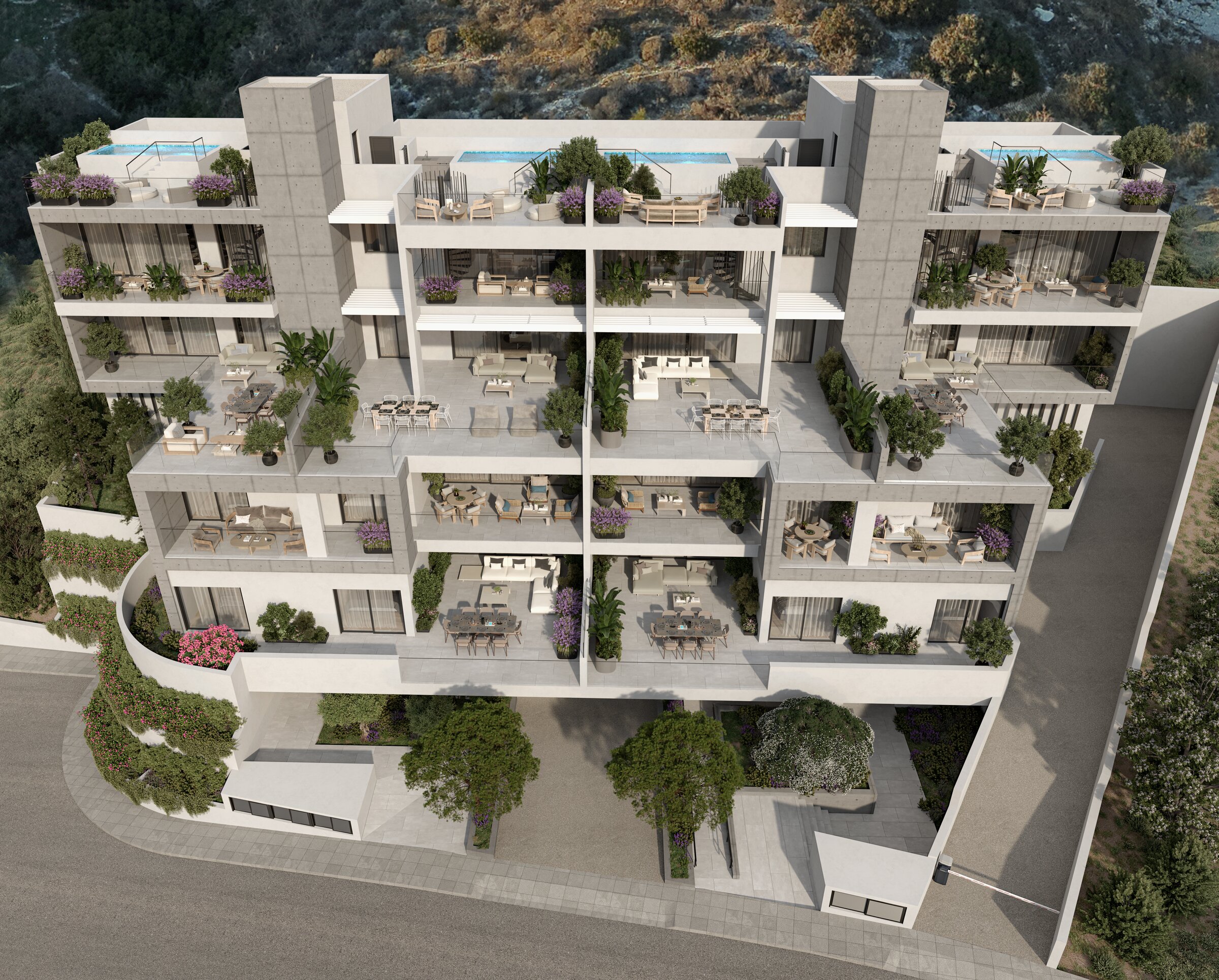 The Alto Mare residences in daylight, framed by landscaped terraces overlooking the Limassol coastline.